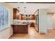 Well-equipped kitchen with granite countertops, stainless steel appliances, and updated cabinetry at 6731 S Kearney Ct, Centennial, CO 80112