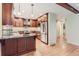 Bright kitchen with stainless steel appliances, a breakfast bar, and sleek countertops with updated cabinets at 6731 S Kearney Ct, Centennial, CO 80112