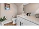 Modern half-bathroom features a white vanity, updated fixtures, and contemporary decor at 3219 W 19Th Ave # 3, Denver, CO 80204