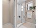 Bright bathroom featuring a tiled shower with a built-in bench and a window at 3219 W 19Th Ave # 3, Denver, CO 80204
