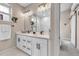 Bathroom featuring a double vanity, modern fixtures, and a walk-in shower at 3219 W 19Th Ave # 3, Denver, CO 80204