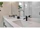 Bathroom featuring a double vanity, modern fixtures, and a walk-in shower at 3219 W 19Th Ave # 3, Denver, CO 80204