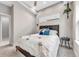 Bright bedroom featuring two windows, modern decor, and carpeted floors at 3219 W 19Th Ave # 3, Denver, CO 80204