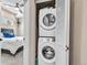 Convenient laundry closet with stacked washer and dryer units, maximizing space in the home at 3219 W 19Th Ave # 3, Denver, CO 80204