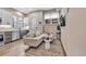 Comfortable living room with a modern couch, decorative rug, and a wall-mounted television at 3219 W 19Th Ave # 3, Denver, CO 80204