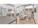 Bright living room featuring modern kitchen, stylish decor, and hardwood flooring at 3219 W 19Th Ave # 3, Denver, CO 80204