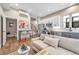 Bright, open-concept living space with modern kitchen, stainless steel appliances and stylish decor at 3219 W 19Th Ave # 3, Denver, CO 80204