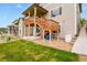 Backyard featuring deck with stairs, green grass, and stone ground cover at 2549 Loon Cir, Castle Rock, CO 80104