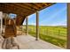 Backyard with a covered patio featuring green grass, and pastoral views at 2549 Loon Cir, Castle Rock, CO 80104
