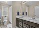 Bathroom featuring a double sink vanity, large mirror, and shower with curtain at 2549 Loon Cir, Castle Rock, CO 80104