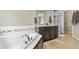 Relaxing bathroom with a deep soaking tub and a separate glass-enclosed shower at 2549 Loon Cir, Castle Rock, CO 80104