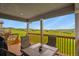 Comfortable covered patio with a scenic view of the green landscape and clear blue sky at 2549 Loon Cir, Castle Rock, CO 80104