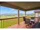 Inviting covered patio featuring comfortable seating and a scenic view of the surrounding landscape at 2549 Loon Cir, Castle Rock, CO 80104