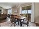 Bright dining area with a sliding glass door leading to a deck and views of the surrounding landscape at 2549 Loon Cir, Castle Rock, CO 80104