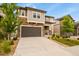 Charming two-story home with a stone facade, attached garage, and well-maintained front yard at 2549 Loon Cir, Castle Rock, CO 80104