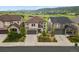 Beautiful two-story home featuring stone accents, a spacious driveway, and manicured landscaping at 2549 Loon Cir, Castle Rock, CO 80104