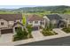 An aerial view of a two-story house with stone accents and manicured landscaping in a suburban neighborhood at 2549 Loon Cir, Castle Rock, CO 80104