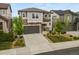 Beautiful two-story home boasting stone accents, a well-manicured lawn, and a driveway leading to a two-car garage at 2549 Loon Cir, Castle Rock, CO 80104