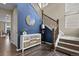 Elegant foyer featuring hardwood floors, a staircase, and a stylish console table at 2549 Loon Cir, Castle Rock, CO 80104
