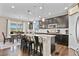 Modern kitchen featuring an island, granite countertops, stainless steel appliances, and a dining area with scenic views at 2549 Loon Cir, Castle Rock, CO 80104