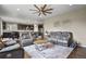 Open-concept living room seamlessly connecting to a modern kitchen and dining area at 2549 Loon Cir, Castle Rock, CO 80104