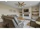 Spacious living room featuring a modern fireplace, floating shelves, and comfortable seating at 2549 Loon Cir, Castle Rock, CO 80104