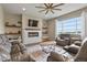Bright living room with a large window, plush seating, and a decorative fireplace at 2549 Loon Cir, Castle Rock, CO 80104