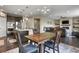 Open living space showcasing the dining area, kitchen, and living room with a fireplace at 2549 Loon Cir, Castle Rock, CO 80104