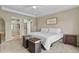 Serene main bedroom with a tray ceiling, cozy decor, and an ensuite bathroom at 2549 Loon Cir, Castle Rock, CO 80104