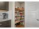 Walk-in pantry with well-organized shelves and storage for all your kitchen needs at 2549 Loon Cir, Castle Rock, CO 80104