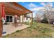 A fenced backyard features a pergola, patio, and play equipment on a grassy lawn at 15104 E Utah Pl, Aurora, CO 80012