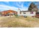 Wide view of backyard with patio, pergola, green space, and play equipment for outdoor enjoyment at 15104 E Utah Pl, Aurora, CO 80012