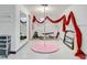 Unique basement space with fitness area, mirrors, and hardwood floors, perfect for dance or gymnastics activities at 15104 E Utah Pl, Aurora, CO 80012