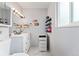 Modern bathroom featuring a double sink vanity and a large mirror at 15104 E Utah Pl, Aurora, CO 80012