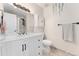 Bright bathroom featuring modern vanity, a large mirror, and new shower at 15104 E Utah Pl, Aurora, CO 80012