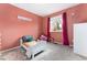 Bedroom featuring pink walls, playful decor, and a cozy atmosphere at 15104 E Utah Pl, Aurora, CO 80012