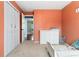 Bright bedroom featuring a closet, dresser, window, and neutral carpet providing comfort at 15104 E Utah Pl, Aurora, CO 80012