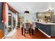 Cozy dining area with wood floors, stylish table, and a sliding door to the outside at 15104 E Utah Pl, Aurora, CO 80012