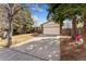 Charming single-story home featuring a brick facade, a two-car garage, and a spacious driveway at 15104 E Utah Pl, Aurora, CO 80012