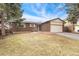 Attractive brick home featuring an attached two-car garage and a neatly maintained front yard at 15104 E Utah Pl, Aurora, CO 80012