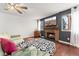 Bright and airy living room featuring hardwood floors, a fireplace, and large windows at 15104 E Utah Pl, Aurora, CO 80012