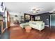 Inviting living room and dining area with hardwood floors and access to the kitchen at 15104 E Utah Pl, Aurora, CO 80012