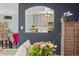 Open-concept living room featuring gray walls and an arched opening to the kitchen at 15104 E Utah Pl, Aurora, CO 80012