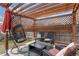 Cozy pergola featuring comfortable seating and lattice privacy at 15104 E Utah Pl, Aurora, CO 80012