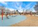 Community playground. Outdoor recreation area with swings, slide, and a variety of play structures at 15104 E Utah Pl, Aurora, CO 80012