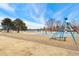 Neighborhood playground with swings, slide, and seesaw surrounded by wood chips at 15104 E Utah Pl, Aurora, CO 80012