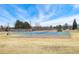 Fenced tennis court and sports court within neighborhood park, promoting an active lifestyle at 15104 E Utah Pl, Aurora, CO 80012