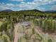 Beautiful aerial view of a wooded home, showcasing the privacy and beauty of the mountain landscape at 9288 Krashin Dr, Conifer, CO 80433