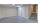 Finished basement space with closet doors and stairs at 9288 Krashin Dr, Conifer, CO 80433