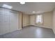 Spacious basement area features a closet, a door, and a window at 9288 Krashin Dr, Conifer, CO 80433